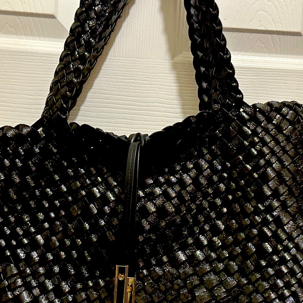 Gently used Calvin Kline black tweed leather.